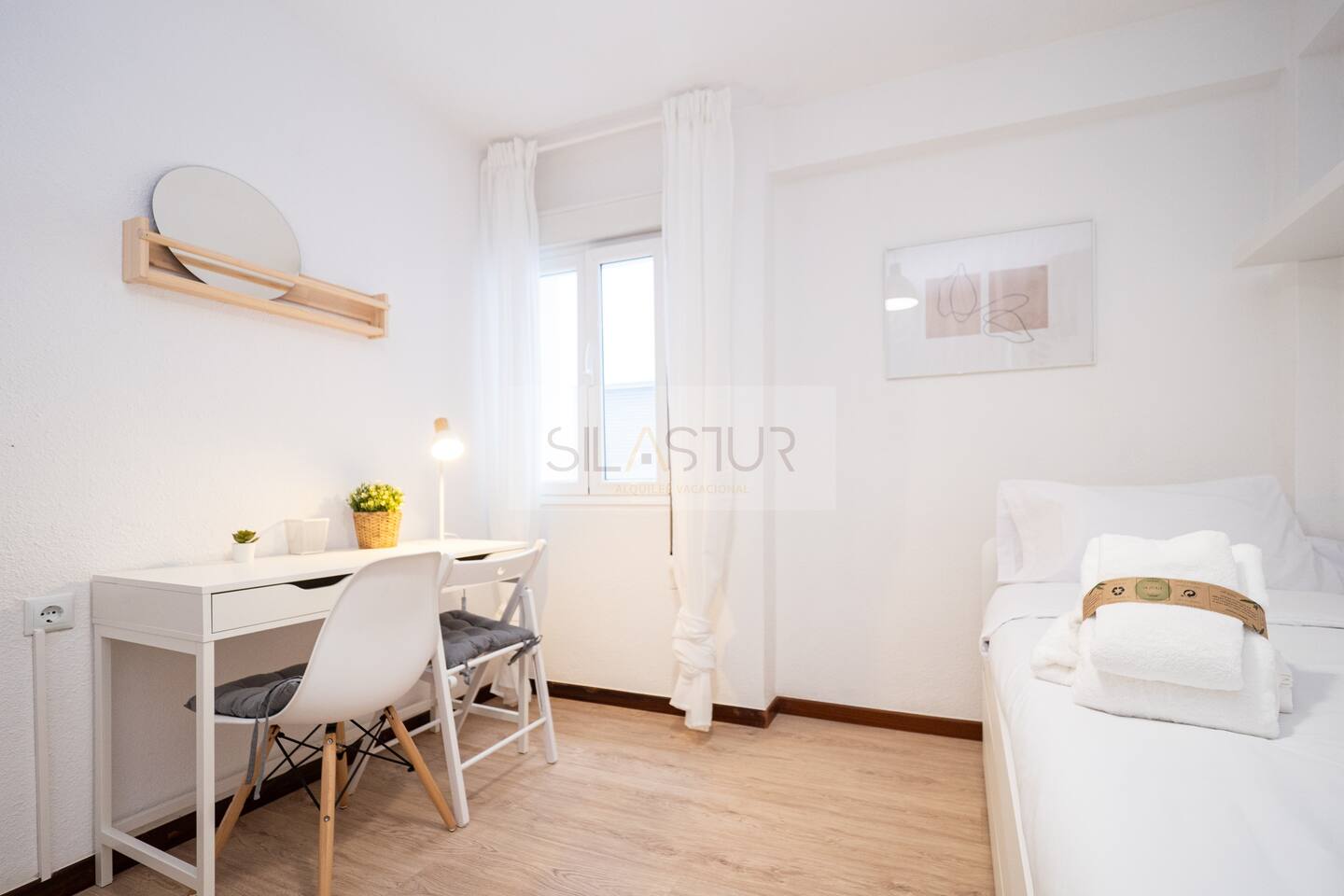Bedroom with desk, chair and single bed